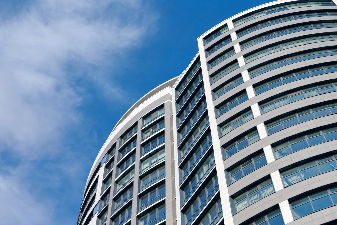 office-skyscraper-high-business-building-on-blue-sky-background-looking-up-to-glass-modern-building.jpg